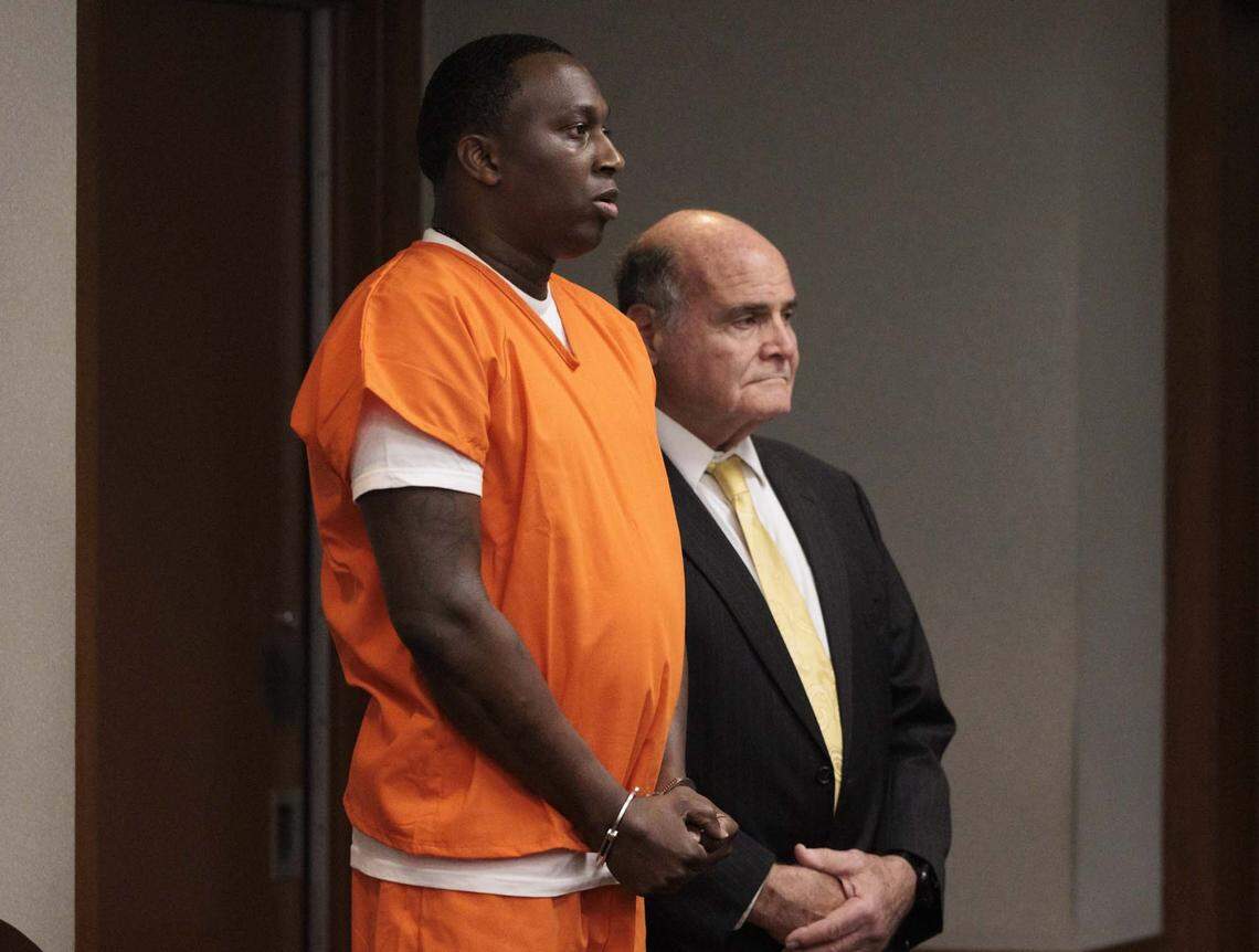 Roderick Martin, left, accused of a 2013 double murder of a church minister and her grandson in her Miami Gardens home, pleads guilty with Reginald Louis Jackson on Wednesday, April 29, 2026, inside the Richard E. Gerstein Justice Building in downtown Miami, Fla.