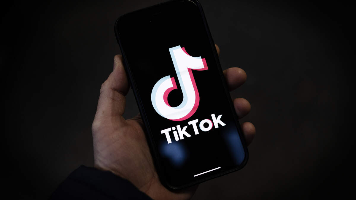 In this photo illustration, a TikTok logo is displayed on an iPhone in London, England. 