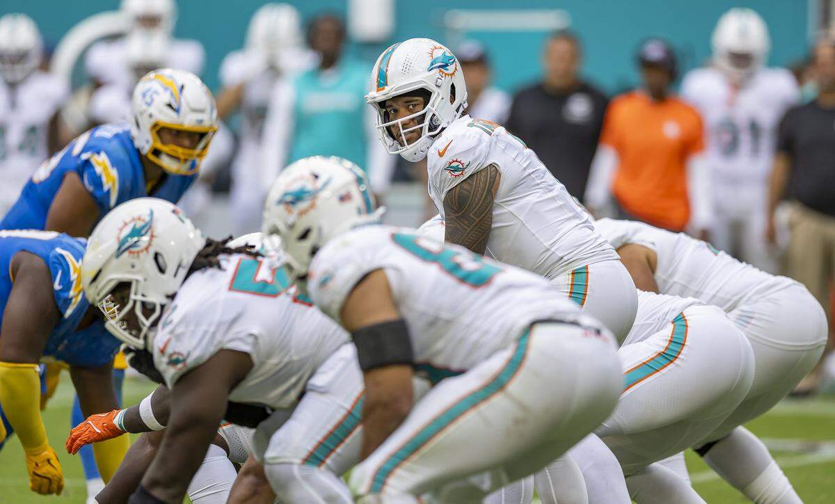 Miami Dolphins quarterback Tua Tagovailoa (1) prepares for the snap at the line of scrimmage against the Los Angeles Chargers in the second half of their NFL game at Hard Rock Stadium on Sunday, Oct. 12, 2025, in Miami Gardens, Fla.