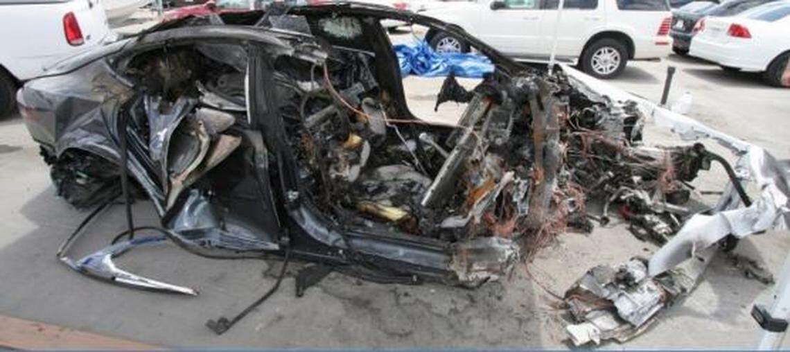 A passenger side view of the 2014 Tesla Model S P85D after the crash.