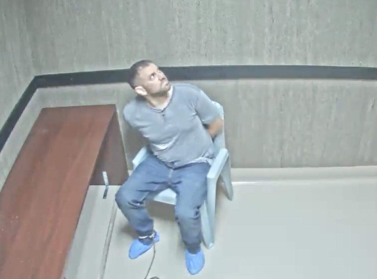 Nathan Gingles looks around after he was placed in an interrogation room. Gingles was arrested on Feb. 16, 2025, on charges of murdering his wife, her father and a neighbor in Tamarac, Florida, on that day.