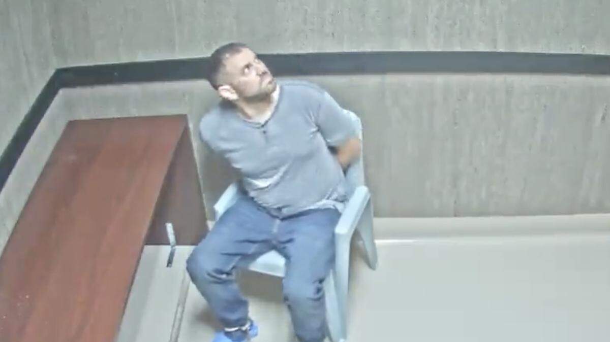 Nathan Gingles looks around after he was placed in an interrogation room. Gingles was arrested and charged with the Feb. 16, 2025, murders of his wife, her father and a neighbor in Tamarac, Florida. 