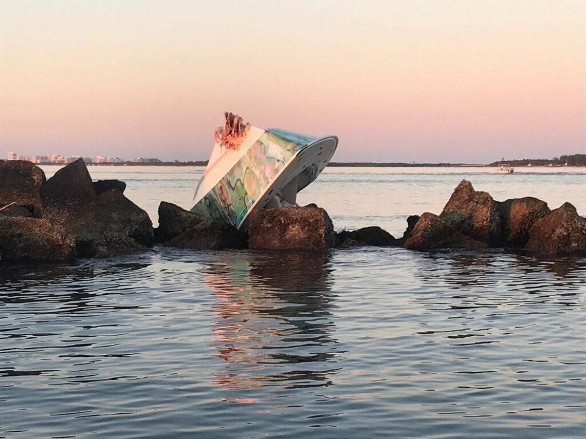 A Lighthouse Point couple is dead after a Saturday night boating crash that flipped this boat on Government Cut’s north jetty, Florida Fish & Wildlife Conservation Commission said.