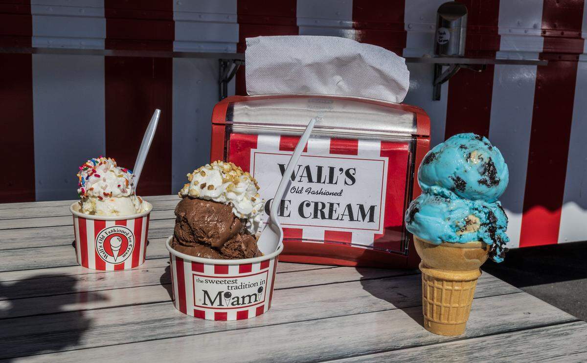 A display several ice creams from left- Birthday Cake with whipped cream and sprinklers, Chocolate brownie with whipped cream and peanuts and Kookie monster on a cake cone, from the menu at the Wall's Old Fashioned Ice cream food truck that has opened on the property of The Big Cheese pizzeria in South Miami, on Tuesday, December 30, 2025.