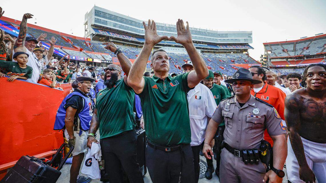 Miami Hurricanes head coach Mario Cristobal flashes the U as the fans celebrate the Canes defeating the Florida Gators in an NCAA college football game at Ben Hill Griffin Stadium in Gainesville, Florida, on Saturday, August 31, 2024.