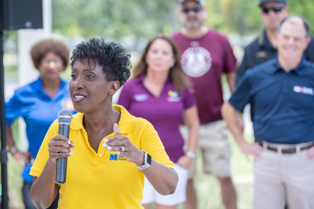 Melida Akiti, chief community officer for Memorial Healthcare System speaks at a “One City at a Time” community health event.