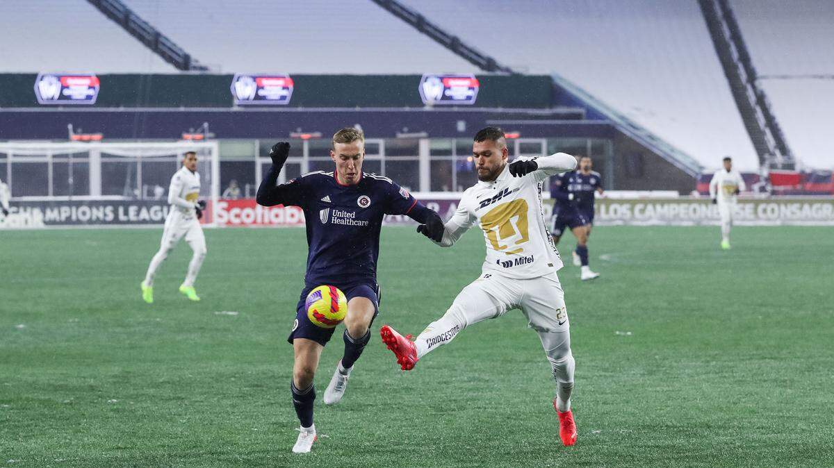 Mar 9, 2022; Foxborough, Massachusetts, USA; Pumas UNAM defender Nicolas Freire (23) defends New England Revolution forward Adam Buksa (9) during the second half at Gillette Stadium during the 2022 CONCACAF Champions League Quarterfinals. Inter Miami is finalizing a deal to sign Freire for the 2024 season.