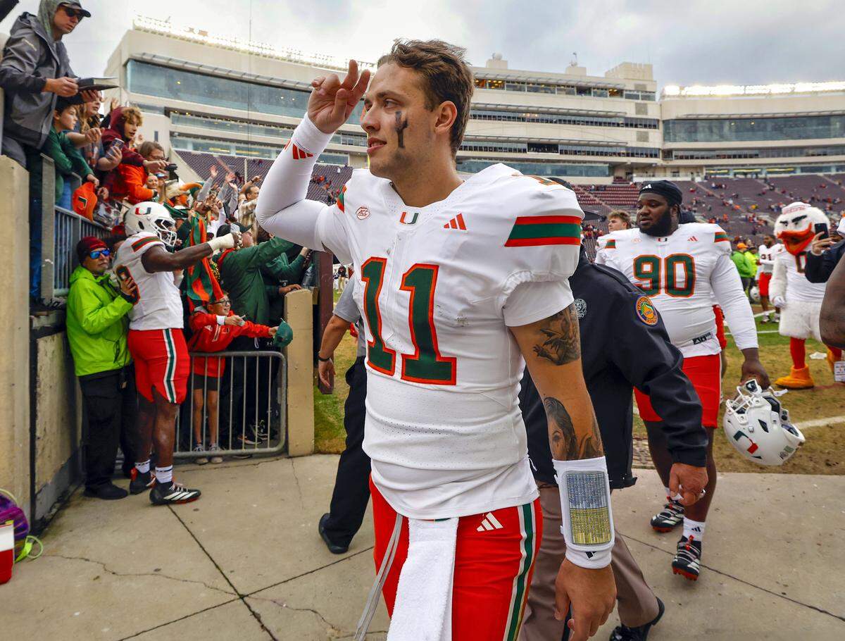Miami Hurricanes quarterback Carson Beck (11) gestures as he comes off the field after the Canes defeat the against the Virginia Tech Hokies at Lane Stadium in Blacksburg, Virginia, on Saturday, November 22, 2025.