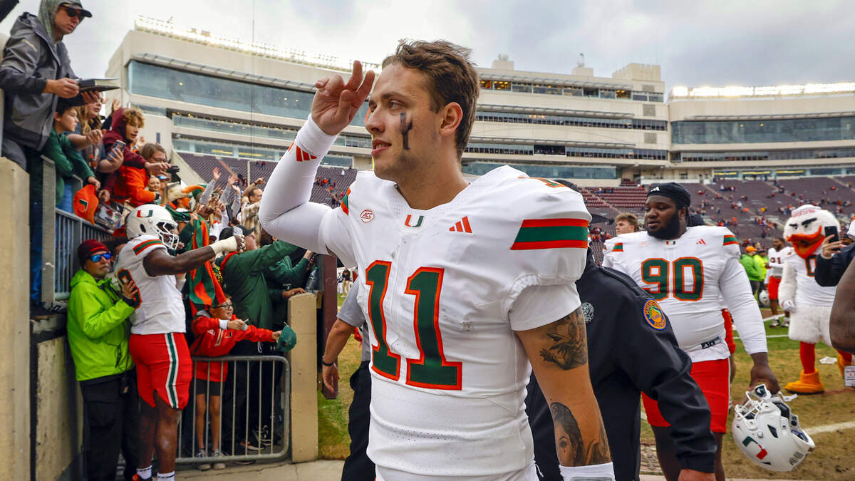 Miami Hurricanes quarterback Carson Beck (11) gestures as he comes off the field after the Canes defeat the against the Virginia Tech Hokies at Lane Stadium in Blacksburg, Virginia, on Saturday, November 22, 2025.