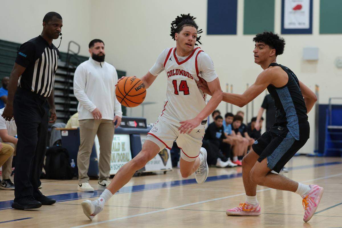 Columbus Explorers guard Felipe Quinones (14) drives to the basket against Palmetto Panthers guard Samfree Sarante (12) during the third quarter of a Greater Miami Athletic Conference boys basketball finals game at Ronald W. Reagan Doral Senior High School on Saturday, Jan. 24, 2026, in Doral, Fla.