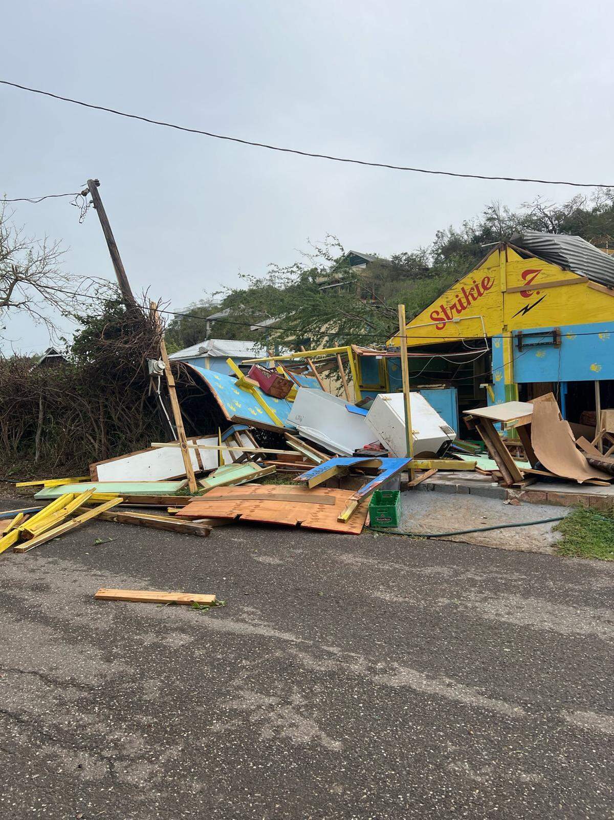 In Treasure Beach, a small fishing and agricultural community on the coast of southern Jamaica, residents said that there was widespread property damage.