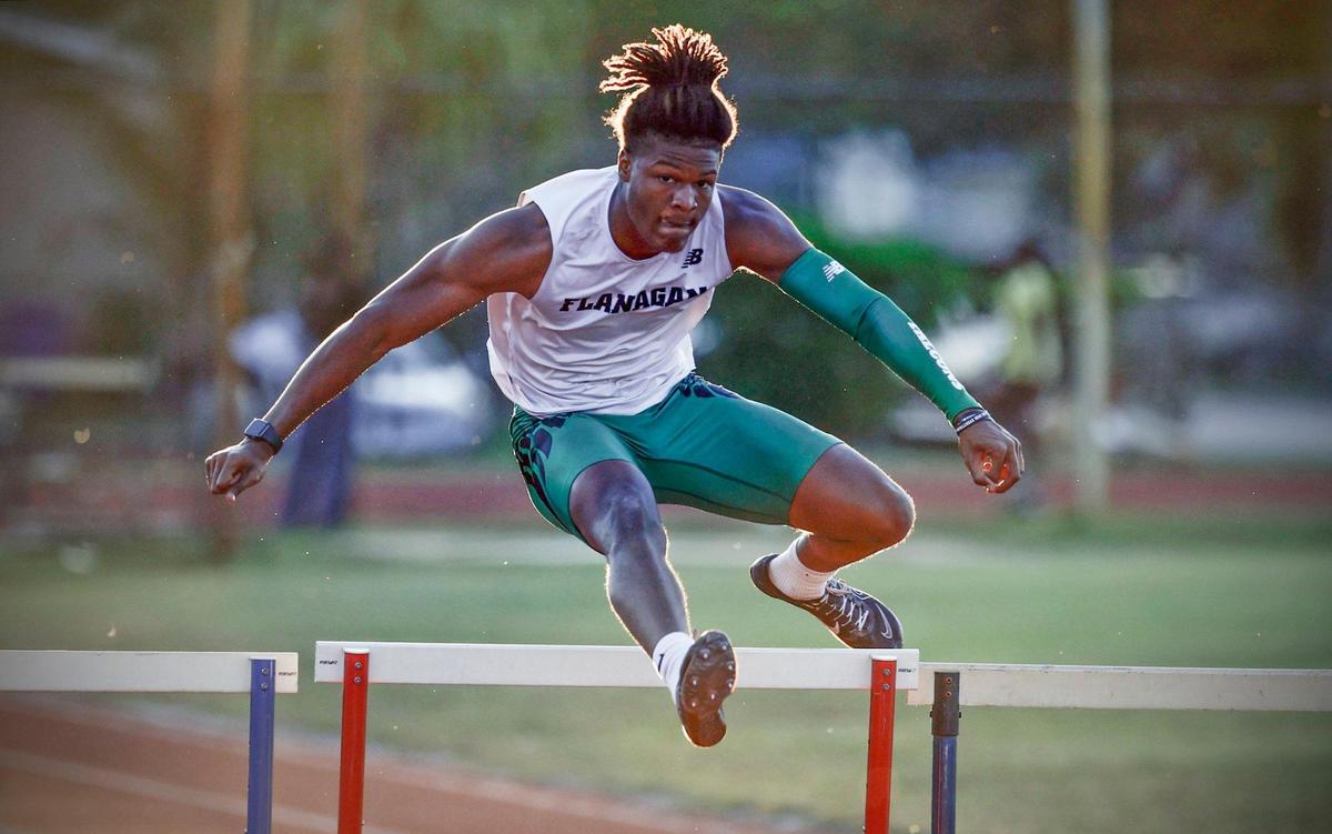 Flanagan’s Jonathan Carter leaps during the 400 Meters Hurdles at the 2024 BCAA Track and Field Championship at Dillard High School in Fort Lauderdale, Florida on Friday, April 5, 2024.