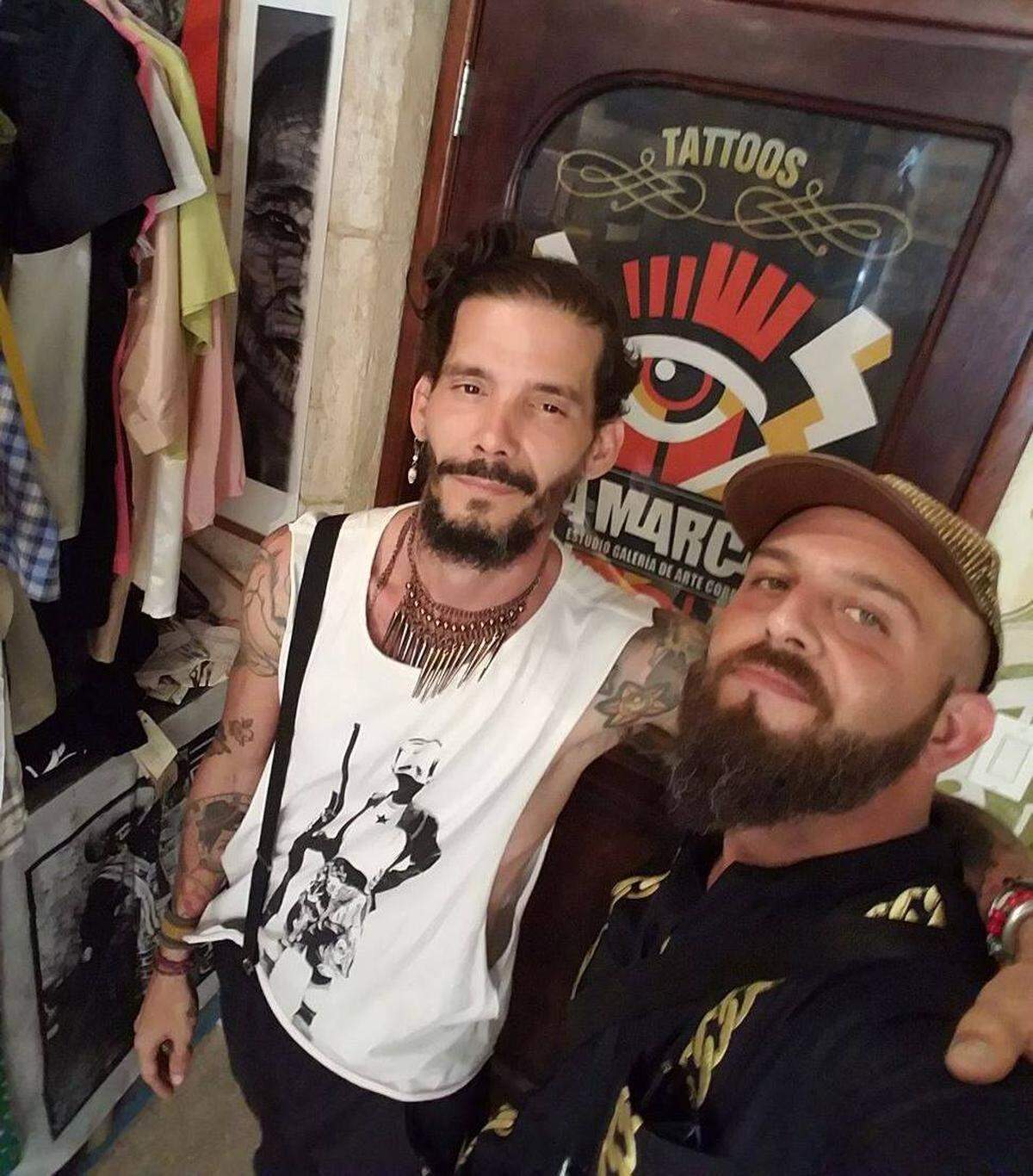 Joe Jenovese, right, with Roberto, a tattoo artist from La Marca tattoo parlor in Havana.