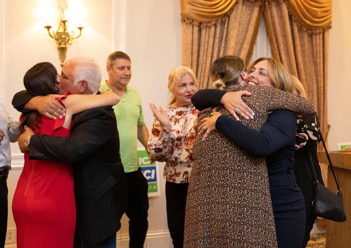 Monica Colucci, right, and Florida Lt. Gov. Jeanette Nuñez, left, hug supporters during Colucci’s victory party at the Renaissance Ballrooms on Tuesday, Aug. 23, 2022, in West Miami. Colucci won the Miami-Dade School Board District 8 seat during the primary election, defeating longtime incumbent Marta Perez.