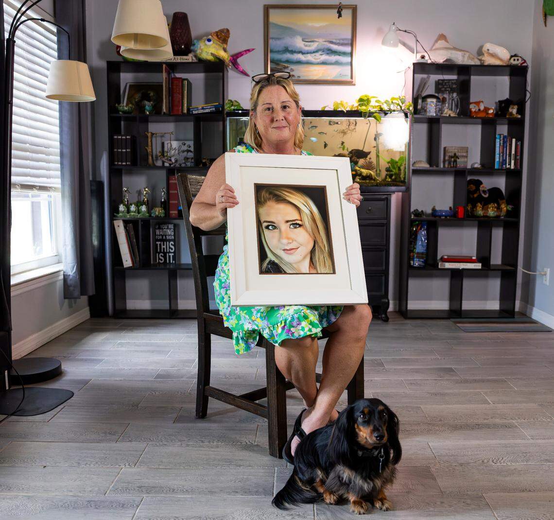 Amy Brunelle holds a photo of her daughter Madison, 18, at her home in Fort Pierce, Florida. Madison died by suicide during a test run of a Brightline train in 2017 in Boca Raton.