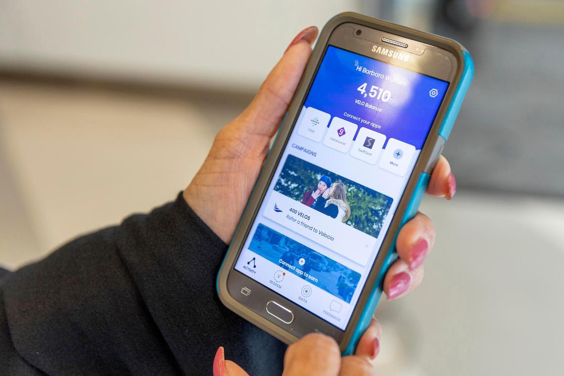 Barbara Walters, a South Florida resident for more than 20 years, shows her Velocia app, a new app that rewards smart, multi-modal transit use at press conference in Miami, Florida on Thursday, December 5, 2019.