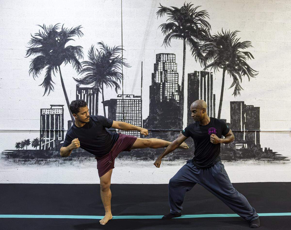 Ryan De Leon, 26, left, and Ekandem Essiet, 41, run drills during a training session at their gym on Tuesday, Aug. 12, 2025, in Miami, Fla. Miami Action Design is the first stunt gym in Miami-Dade County and offers classes that teach members how to become stunt performers for movies and television.