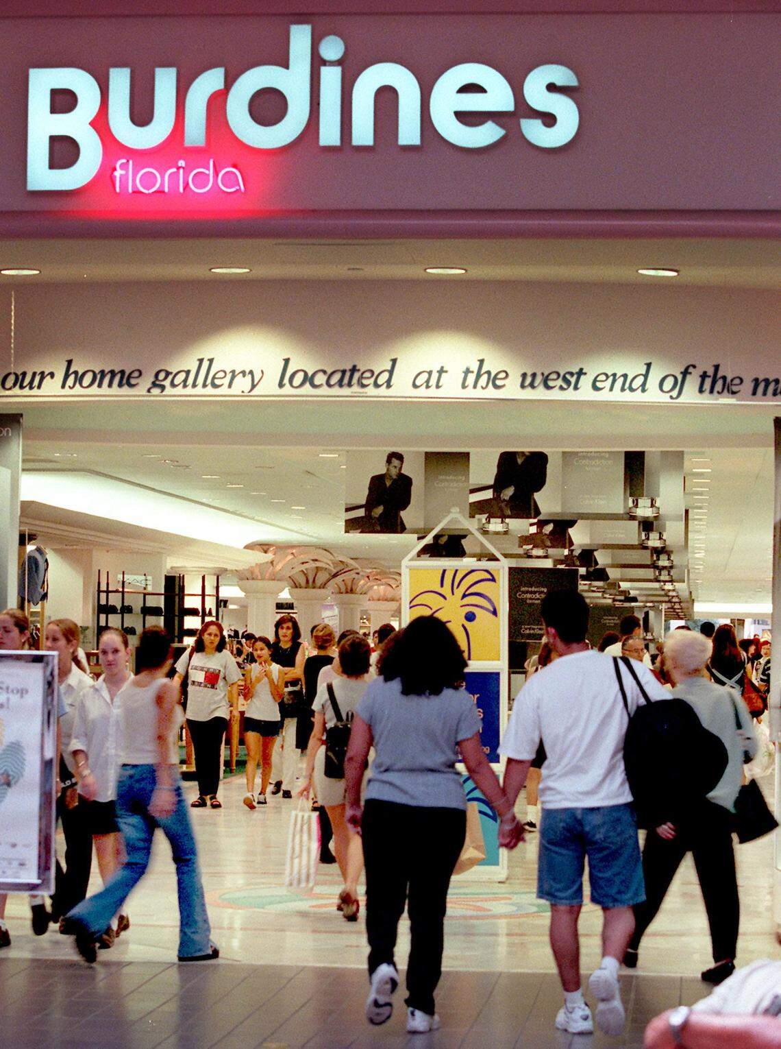 Shoppers enter the Dadeland Burdines from the east end of the Dadeland Mall.
