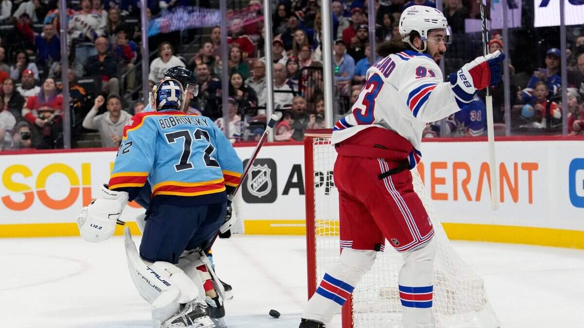 New York Rangers center Mika Zibanejad reacts after scoring a goal against Florida Panthers goaltender Sergei Bobrovsky (72) during the first period of an NHL hockey game, Sunday, Jan. 1, 2023, in Sunrise, Fla. (AP Photo/Lynne Sladky)