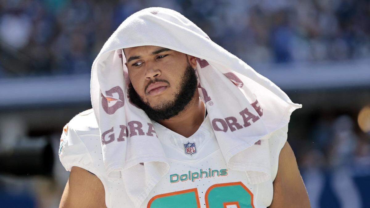 Miami Dolphins offensive tackle Larry Borom (79) reacts late in the fourth quarter during the game against the Indianapolis Colts in the NFL game at Lucas Oil Stadium in Indianapolis on Sunday, September 7, 2025.