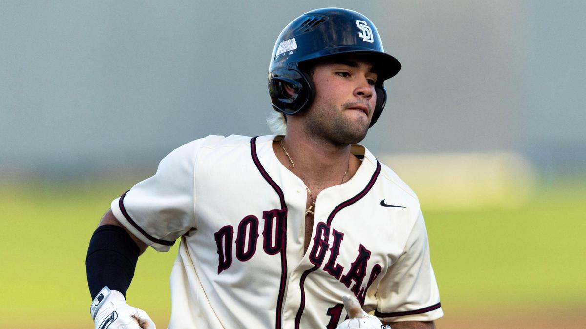 Marjory Stoneman Douglas base runner Christian Rodriguez (10) rounds third base after homering during the second inning of a high school baseball game against Columbus at Columbus High School in Miami, Florida, on Friday, March 24, 2023.