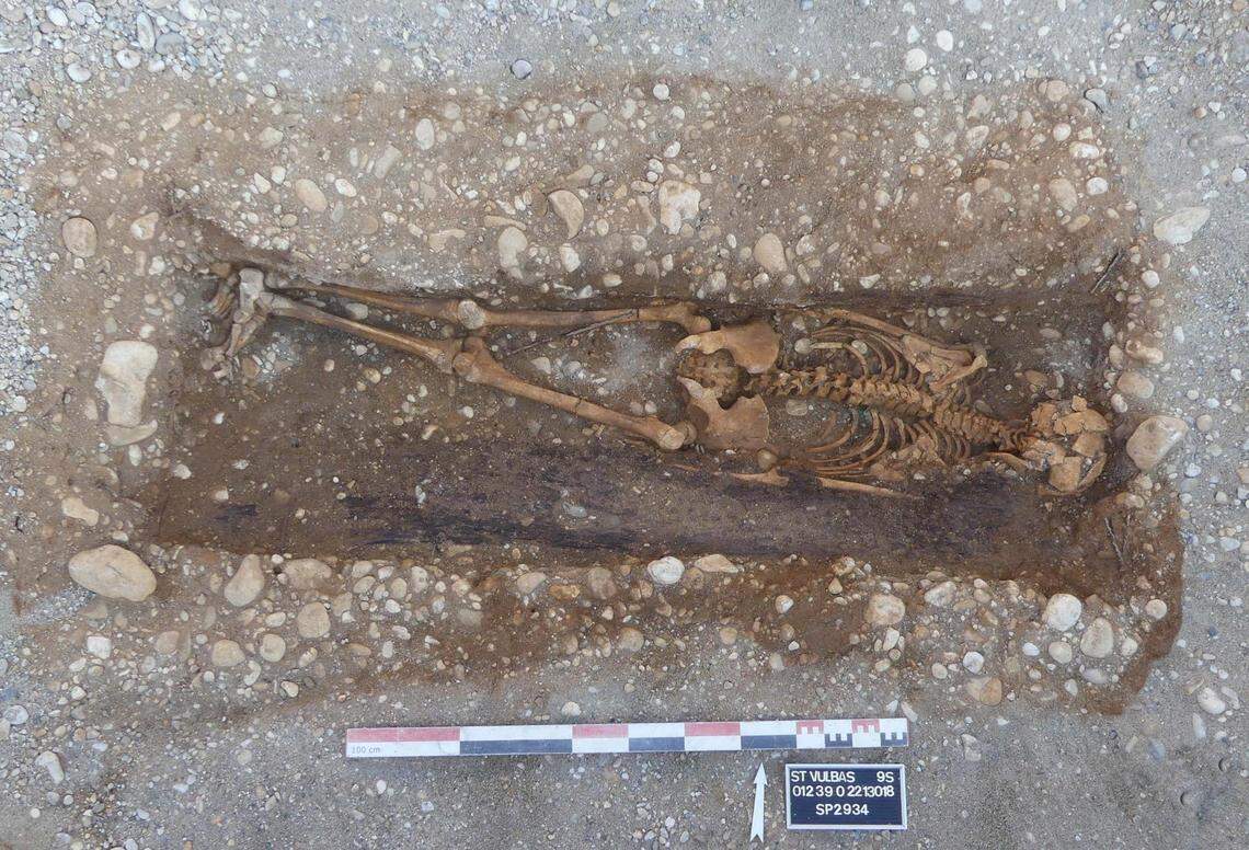 The remains of a 14- to 16-year-old buried in a nail coffin.