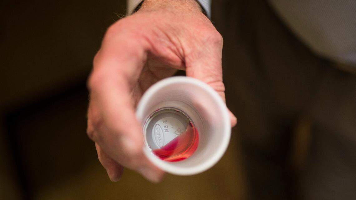 In this March 7, 2017 photo, Paul “Rip” Connell, CEO of Private Clinic North, a methadone clinic, shows a 35 mg liquid dose of methadone at the clinic in Rossville, Ga.