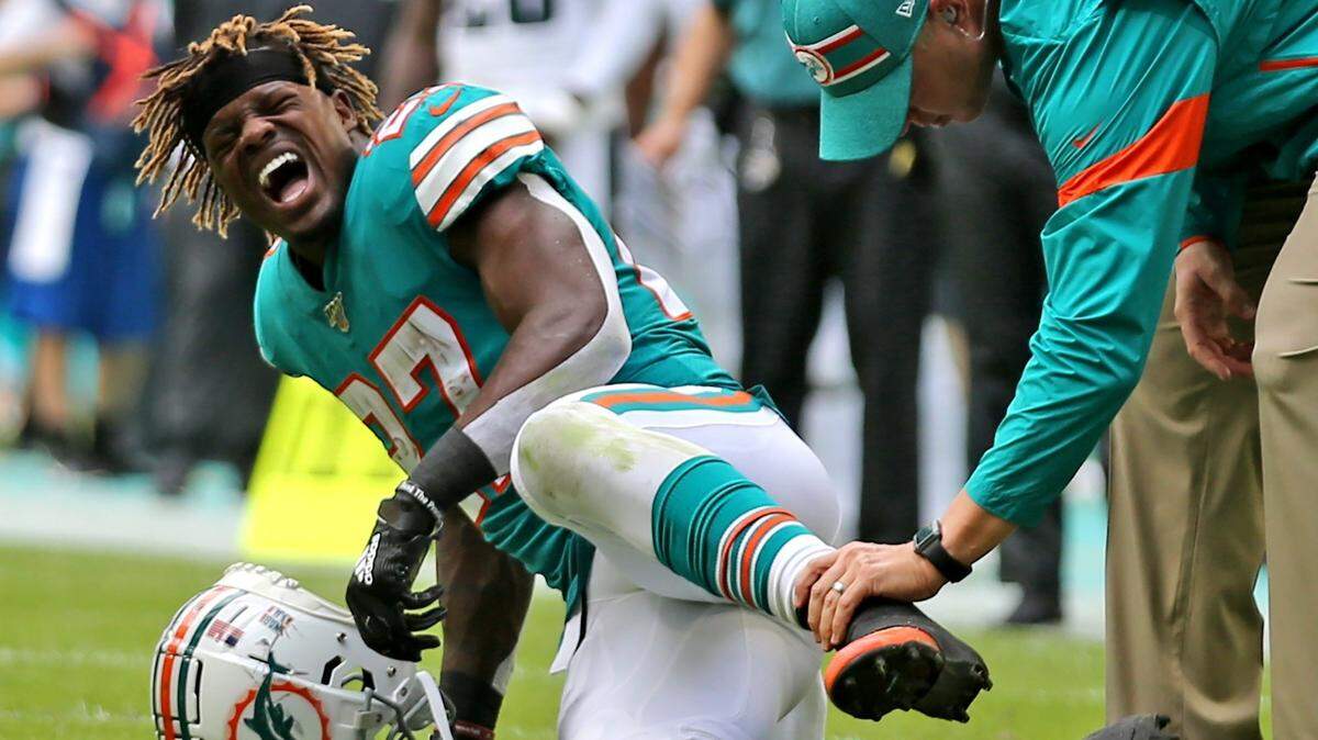 Miami Dolphins running back Kalen Ballage (27) is injured in the second quarter as they play the Philadelphia Eagles at Hard Rock Stadium in Miami Gardens, Florida, Sunday, December, 1, 2019.