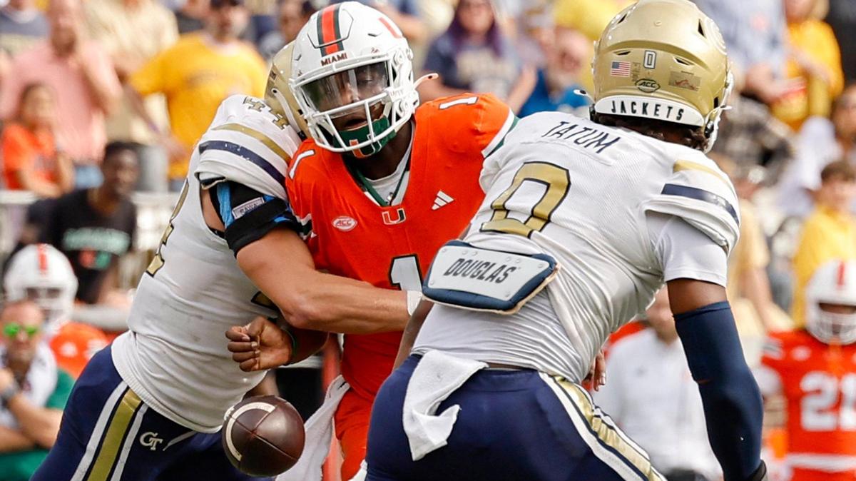 Miami Hurricanes quarterback Cam Ward (1) loses possession of the ball against the Georgia Tech Yellow Jackets in the second half during an NCAA game at Bobby Dodd Stadium at Hyundai Field in Atlanta, Georgia on Saturday, November 9, 2024.