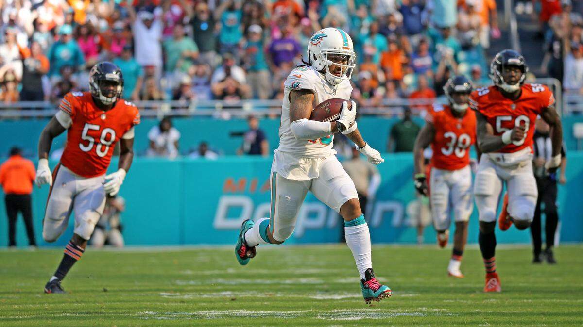 Miami Dolphins receiver Albert Wilson is chased by the Chicago Bears defense as he scores a touchdown - his second TD in the fourth quarter - to tie Sunday’s game at 28. Miami went on to win in overtime.