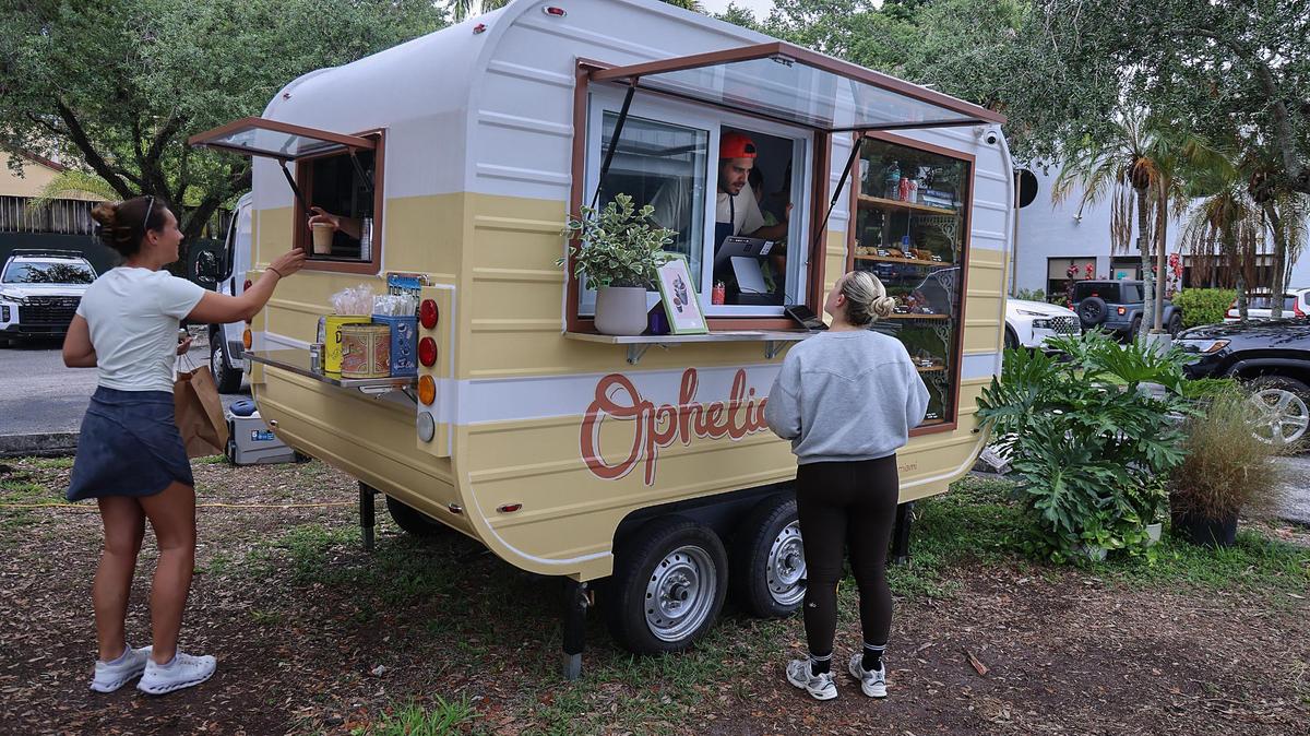 Customers pick up and make their orders at Ophelia, a bakery that just opened in a Miami parking lot.