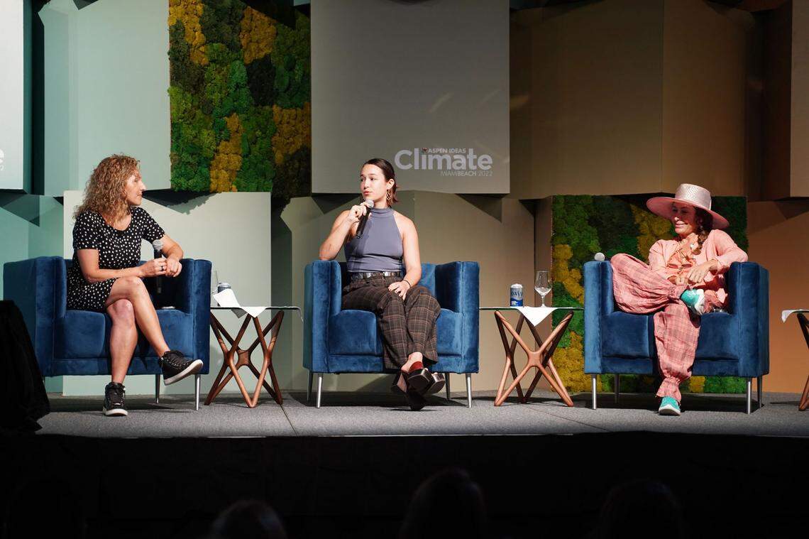 Three women speak on stage during the Aspen Ideas: Climate Summit.