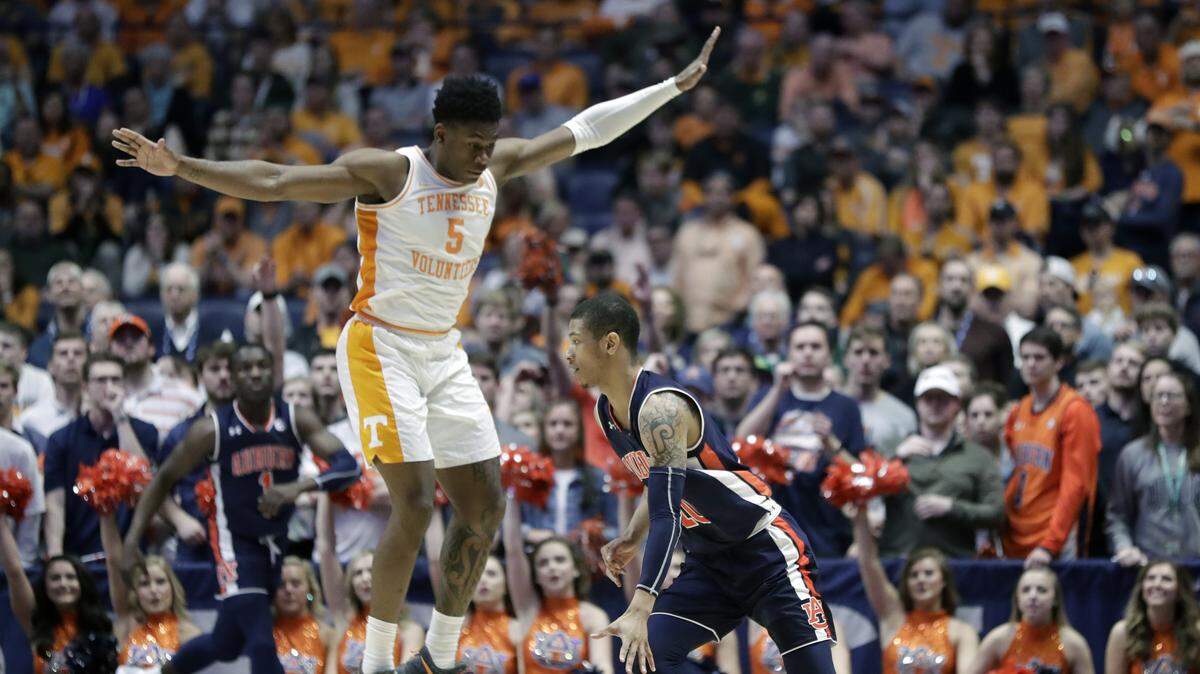 Auburn’s Samir Doughty drives around Tennessee’s Admiral Schofield (5) in the second half of the NCAA college basketball Southeastern Conference championship game Sunday, March 17, 2019, in Nashville, Tenn.