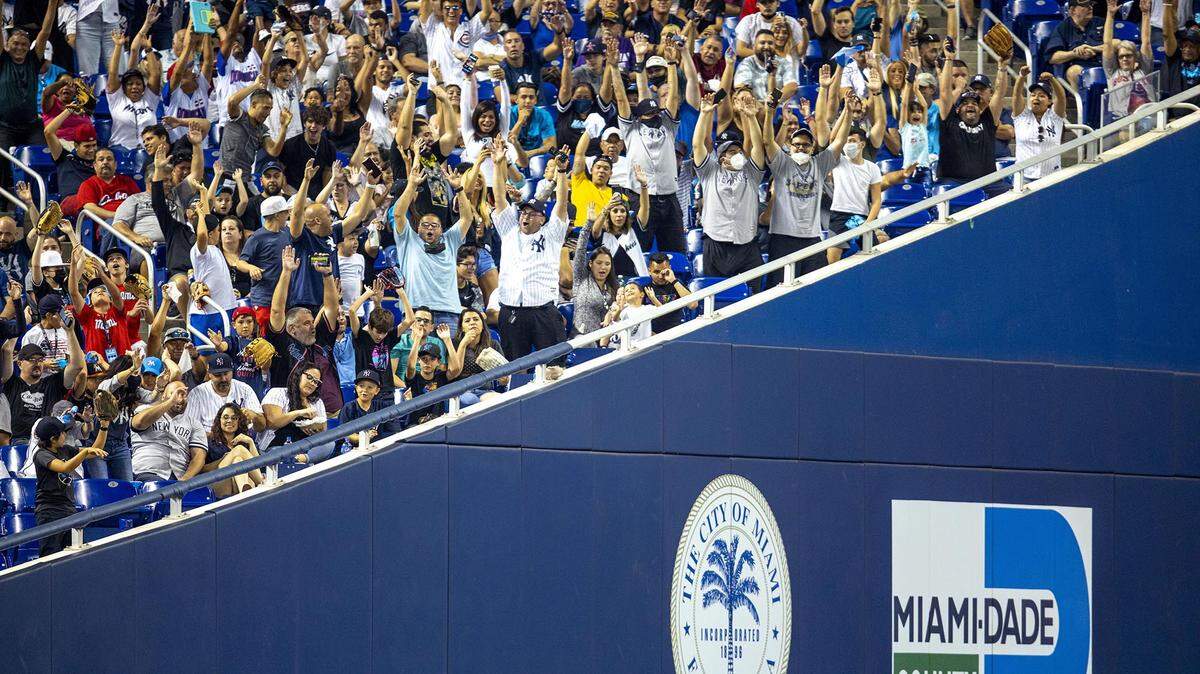 Fans do the wave during the eighth inning of an MLB game between the Miami Marlins and the New York Yankees at loanDepot park in the Little Havana neighborhood of Miami, Florida, on Saturday, July 31, 2021.