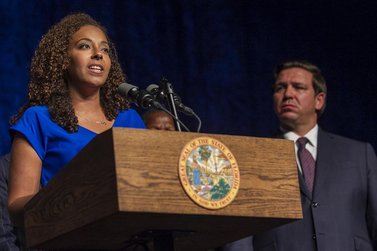 Janeris Marte, 37, speaks during press conference as Florida Governor Ron DeSantis listens at Greater Miami Adventist Academy near Tamiami on Friday, Feb. 15, 2019. DeSantis announced he would create a plan for “equal opportunity scholarships” to relieve the wait list for student tax credit scholarships. Marte has been on a waitlist since summer 2018.