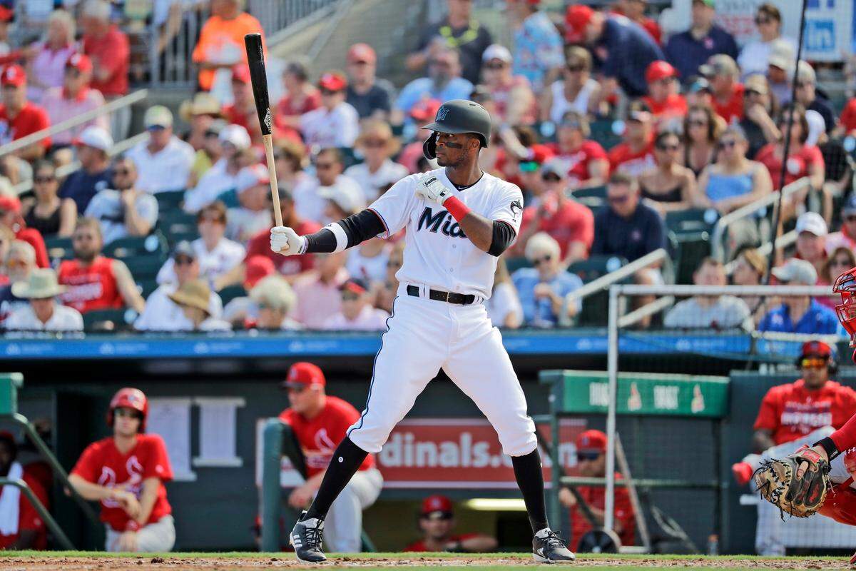 Miami Marlins’ Lewis Brinson bats during the third inning of an exhibition spring training baseball game against the St. Louis Cardinals Saturday, Feb. 23, 2019, in Jupiter, Fla. (AP Photo/Jeff Roberson)