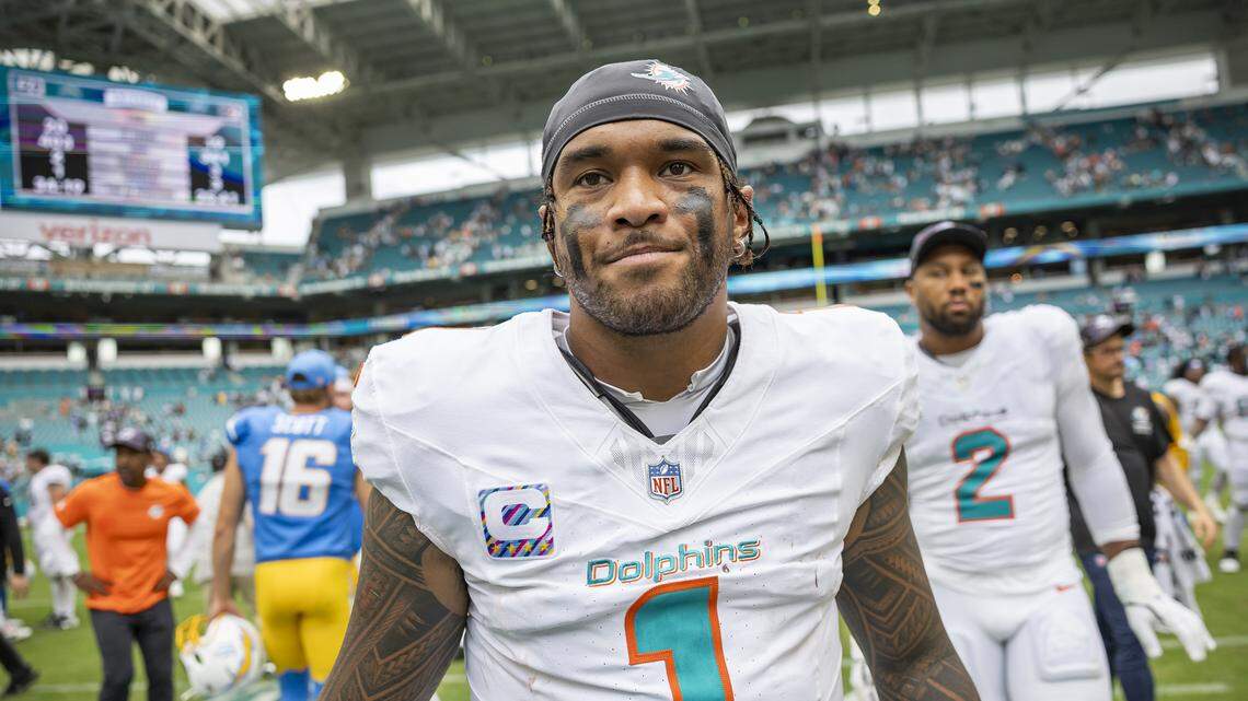 Miami Dolphins quarterback Tua Tagovailoa (1) makes his way back to the locker room after losing their NFL game against the Los Angeles Chargers at Hard Rock Stadium on Sunday, Oct. 12, 2025, in Miami Gardens, Fla.