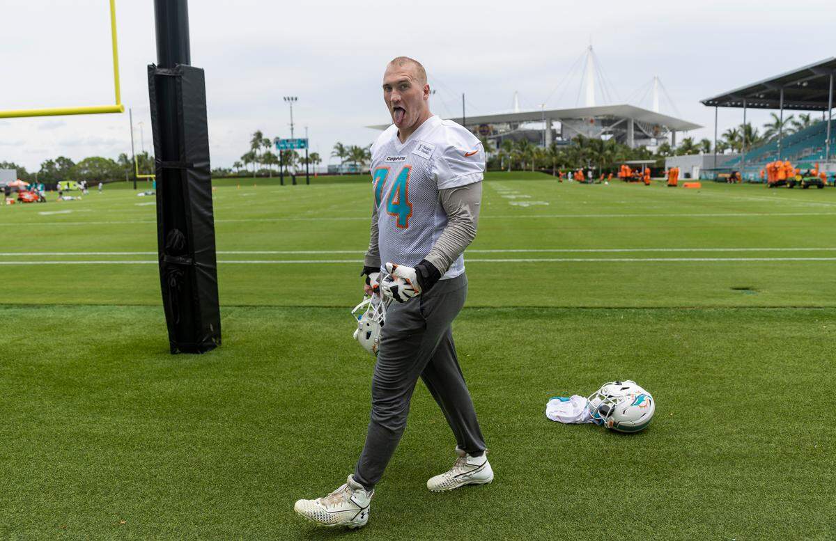 Miami Dolphins offensive tackle Liam Eichenberg (74) reacts after speaking to the media during team practice at the Baptist Health Training Complex on Wednesday, May 31, 2023, in Miami Gardens, Fla.