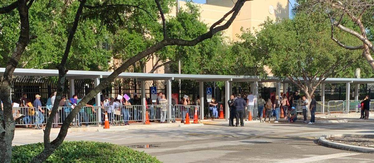 Almost 200 non-detained immigrants stood outside the ICE facility in Miramar waiting for their mandatory check-ins.