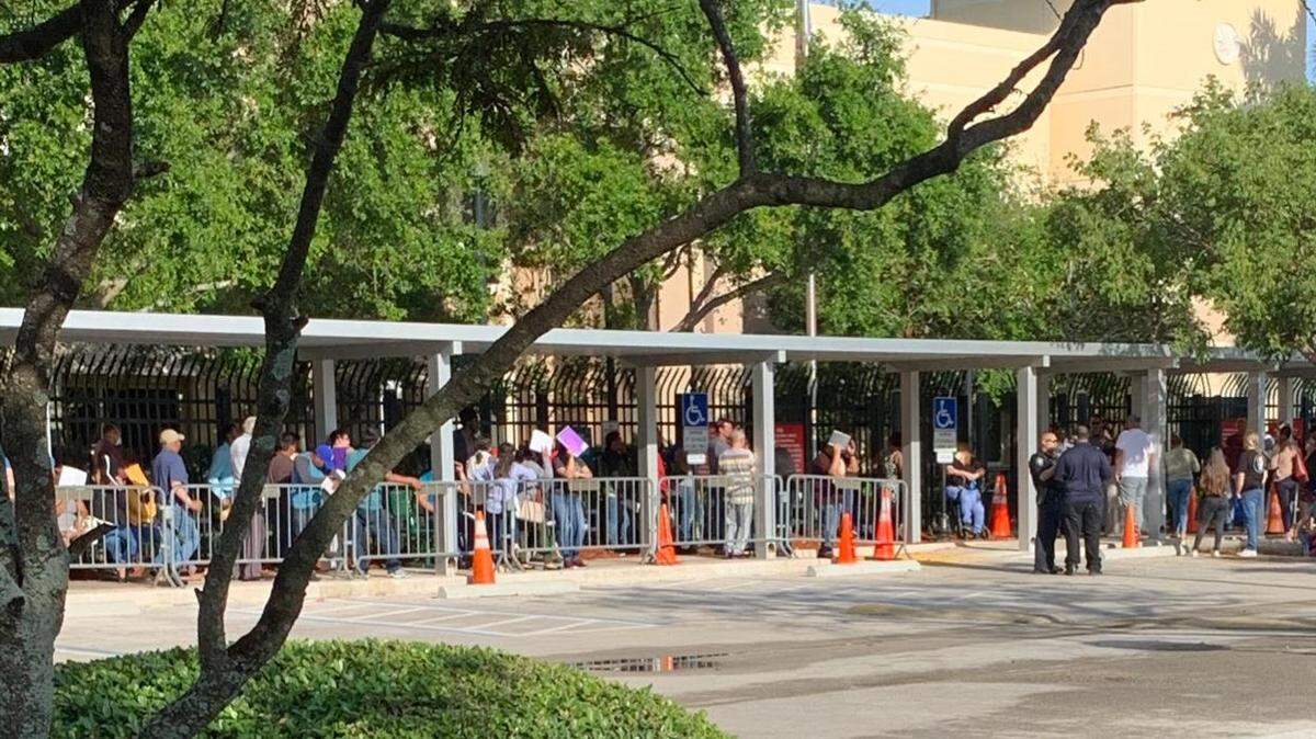 Immigrants wait in line at the Miramar office of Immigration and Customs Enforcement.