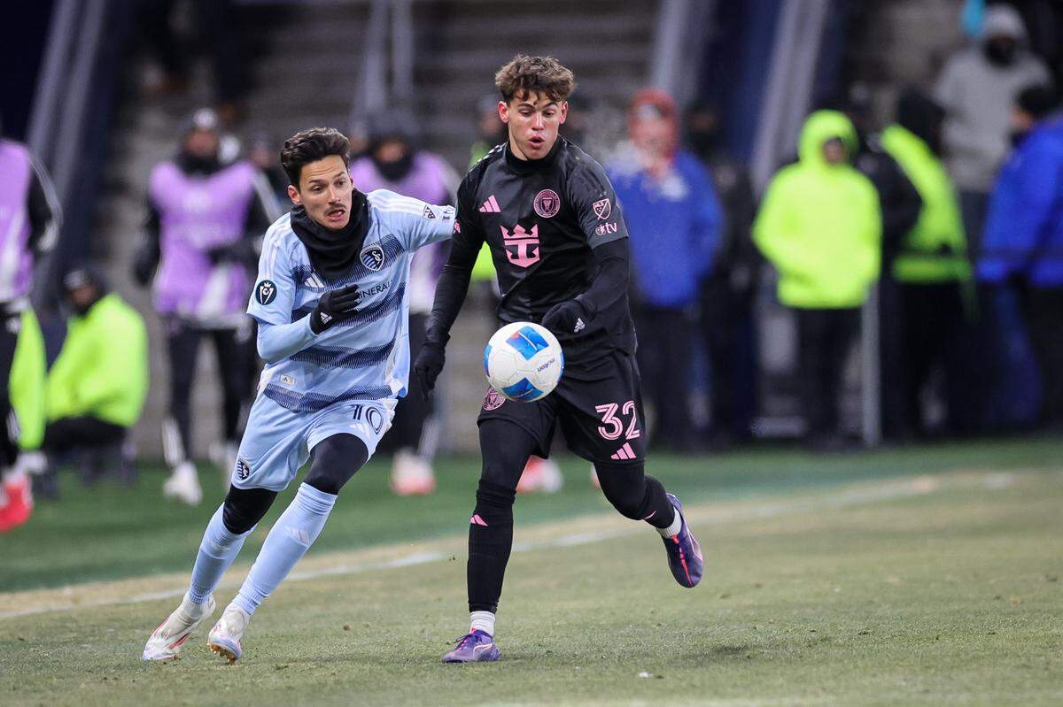 Feb 19, 2025; Kansas City, Kansas, USA; Inter Miami defender Noah Allen (32) and Sporting Kansas City forward Daniel Salloi (10) go after the ball during the second half at Children’s Mercy Park. Mandatory Credit: William Purnell-Imagn Images