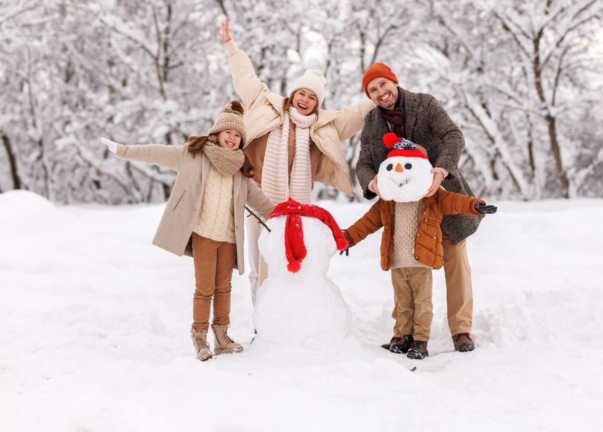 family building snowman together