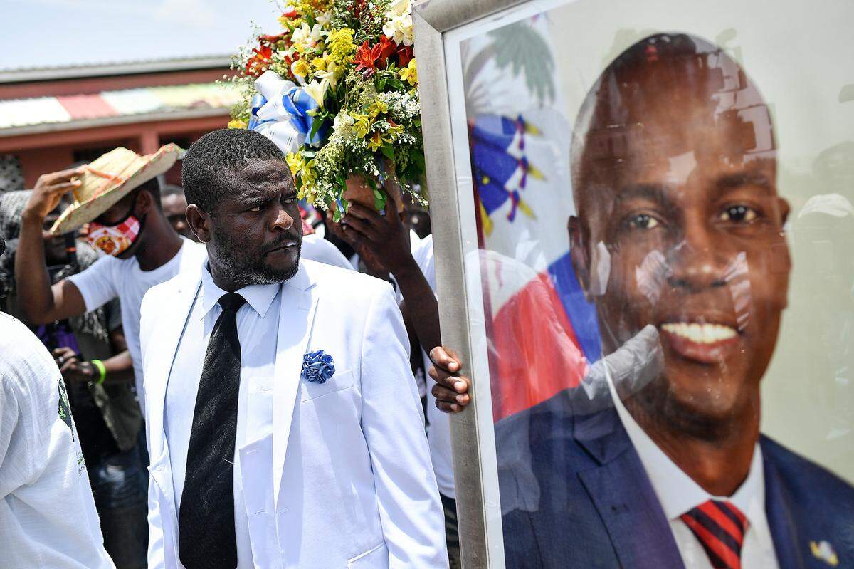 Jimmy Cherizier, alias Barbecue, a former police officer who heads a gang coalition known as “G9 Family and Allies,” leads a march to demand justice for slain Haitian President Jovenel Moïse in La Saline neighborhood of Port-au-Prince, Haiti, Monday, July 26, 2021. Moïse was assassinated on July 7 at his home.