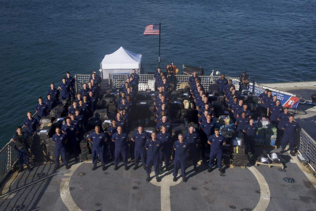 Pictured is the Coast Guard Cutter Tampa (WMEC-902) crew standing among approximately 27,000 pounds of seized cocaine on March 22, 2019, at Coast Guard Base Miami Beach.