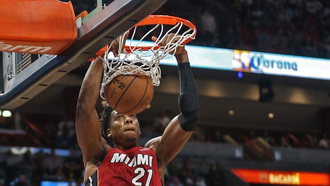 The Heat’s Hassan Whiteside throws down a basket over Utah’s Rudy Gobert (27) in the second quarter Sunday, Dec. 2, 2018, at the AmericanAirlines Arena in Miami.