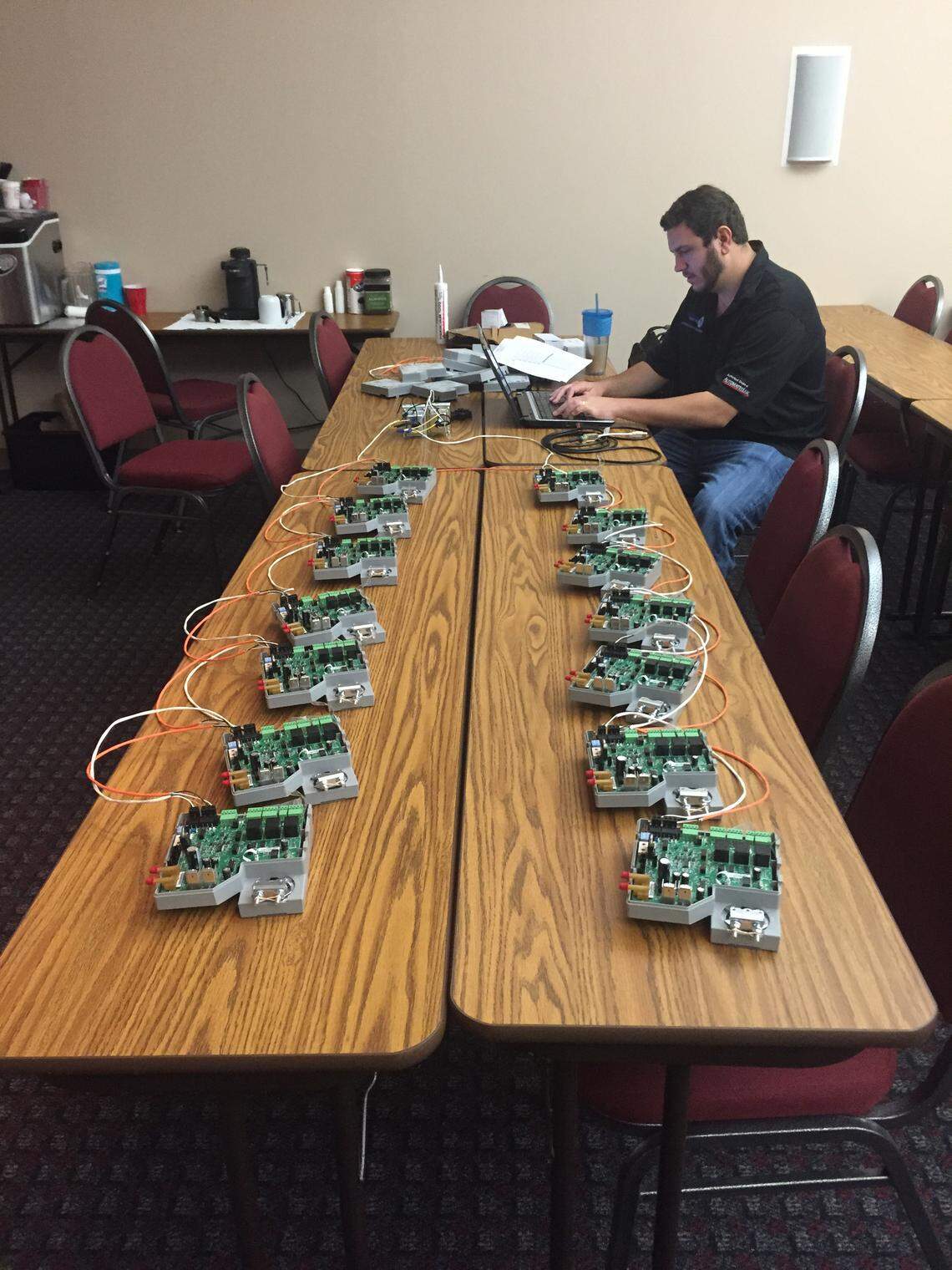 An electrician prepares wiring at Miami Marine Stadium.