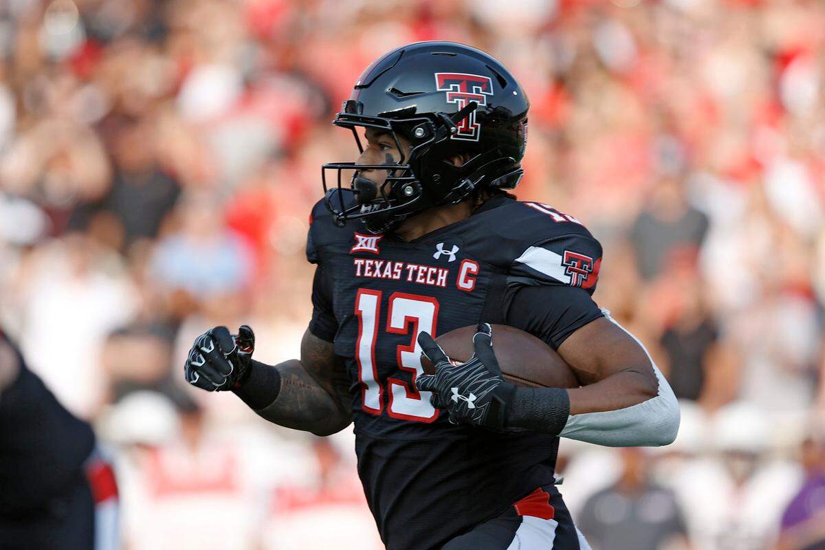 Texas Tech’s Erik Ezukanma (13) runs with the ball during the first half of the team’s NCAA college football game against Stephen F. Austin, Saturday, Sept. 11, 2021, in Lubbock, Texas. (AP Photo/Brad Tollefson)