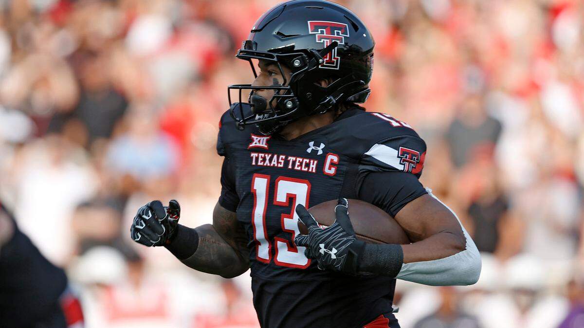 Texas Tech’s Erik Ezukanma (13) runs with the ball during the first half of the team’s NCAA college football game against Stephen F. Austin, Saturday, Sept. 11, 2021, in Lubbock, Texas. (AP Photo/Brad Tollefson)