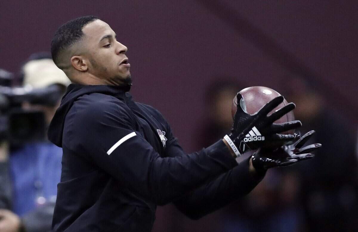 Former Mississippi State safety Johnathan Abram reaches for a pass during drills while getting tested by NFL football scouts and coaches during Pro Day at Mississippi State, Wednesday, March 27, 2019, in Starkville, Miss.