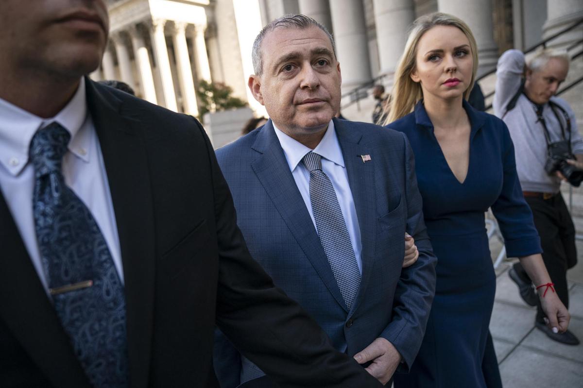 Lev Parnas, center, and his wife, Svetlana Parnas, depart federal court following an arraignment hearing on Oct. 23, 2019, in New York City. Lev Parnas and Igor Fruman, along with Andrey Kukushkin and David Correia, are associates of Rudy Giuliani who were charged with conspiring to circumvent federal campaign finance laws in schemes to funnel foreign money to U.S. candidates running for office at the federal and state levels.